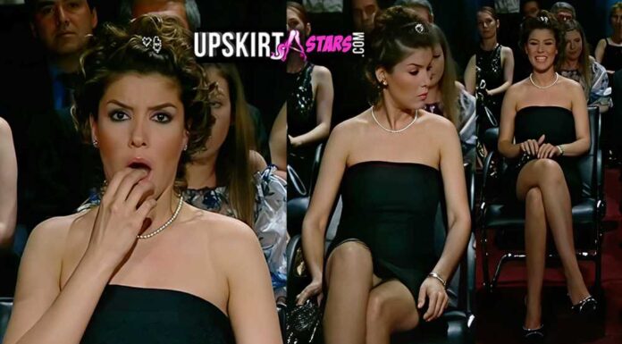 Gülben Ergen’s white panties are visible from under her black miniskirt in a TV series